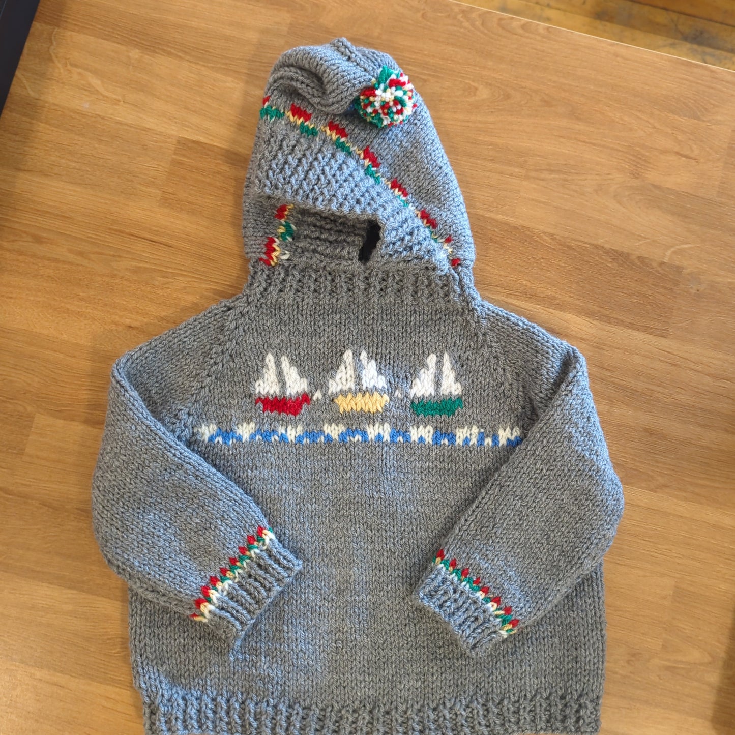 Hand knit baby sweaters