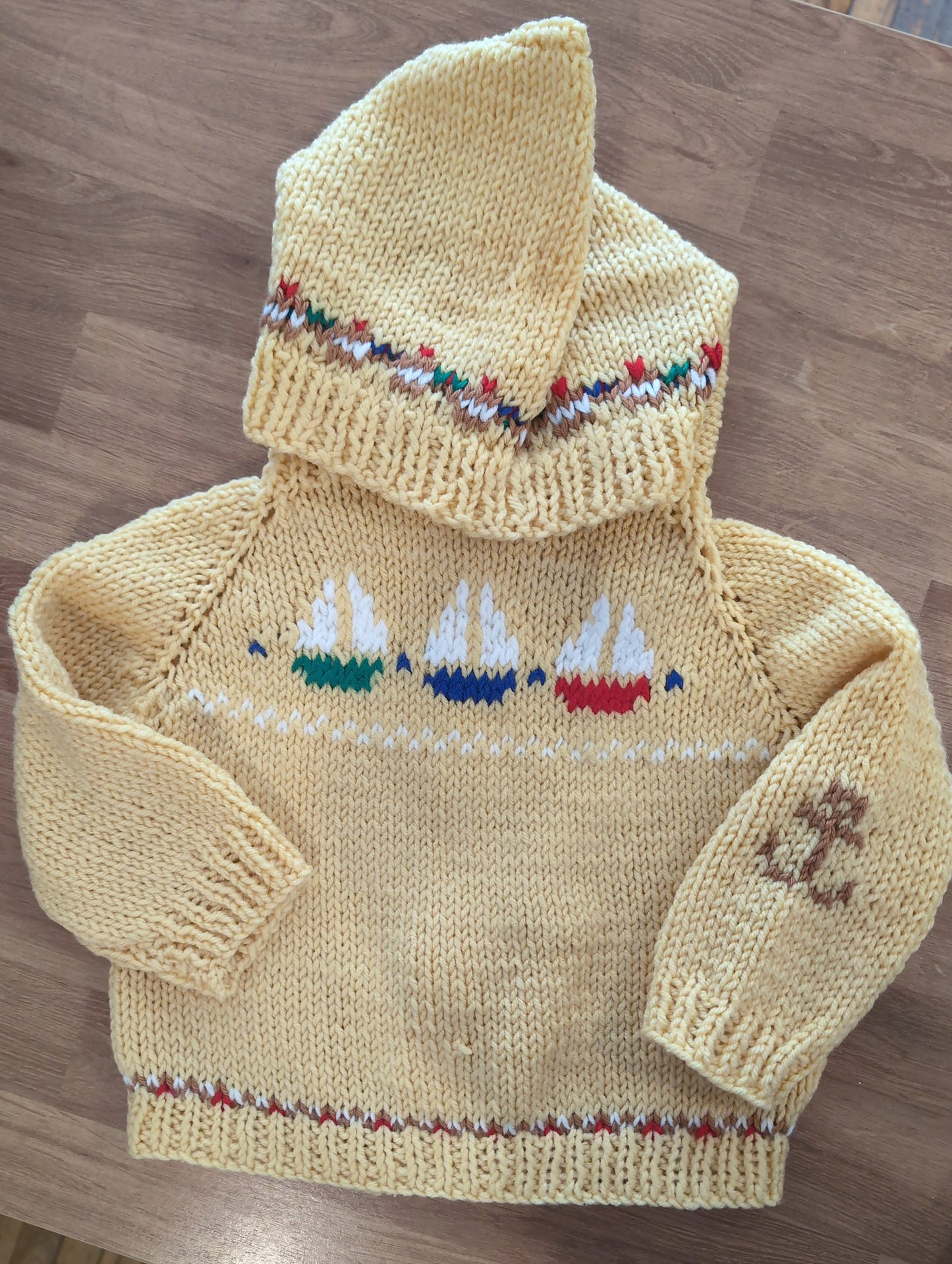 Hand knit baby sweaters