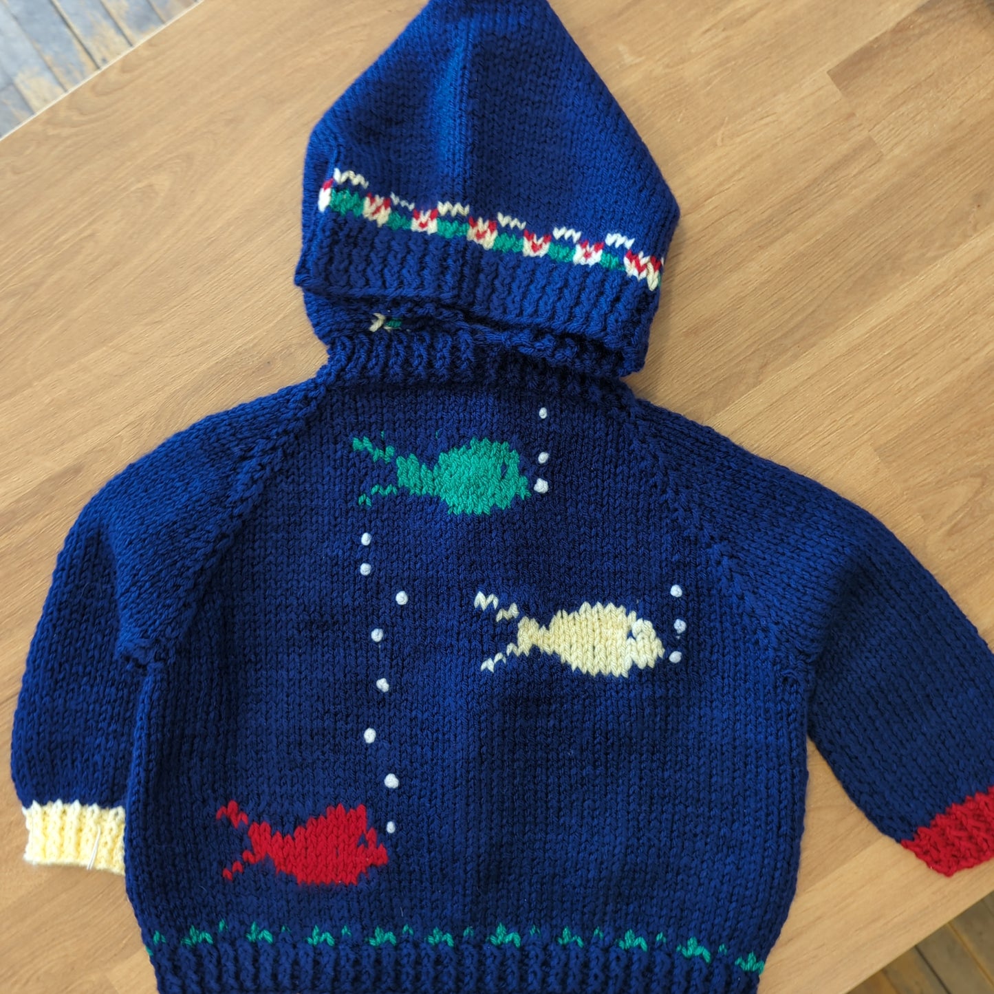 Hand knit baby sweaters