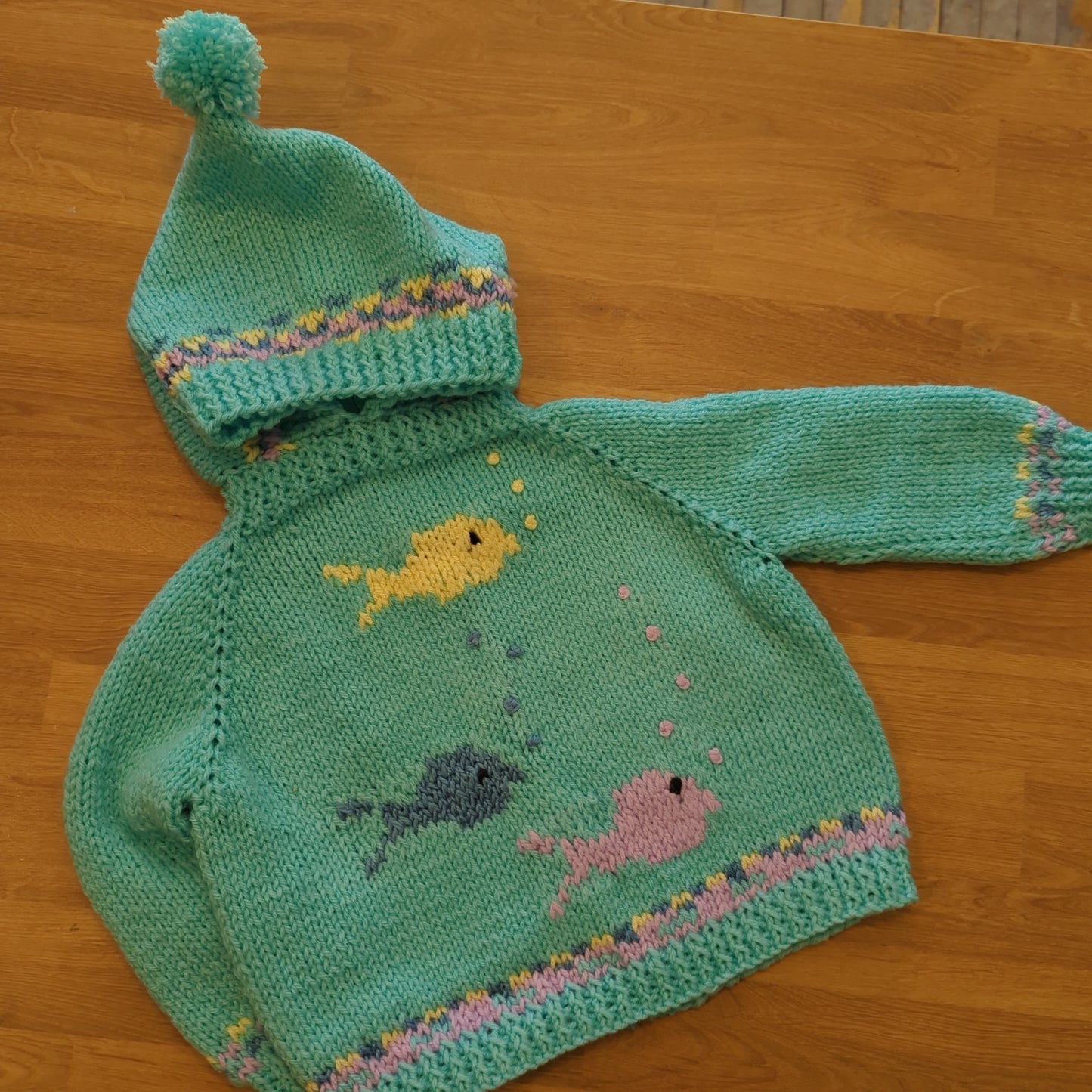 Hand knit baby sweaters