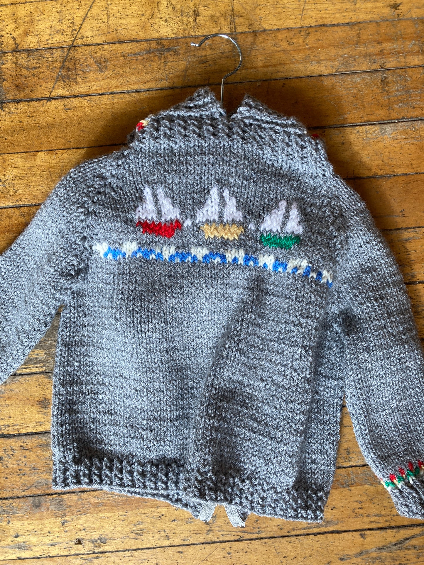 Hand knit baby sweaters