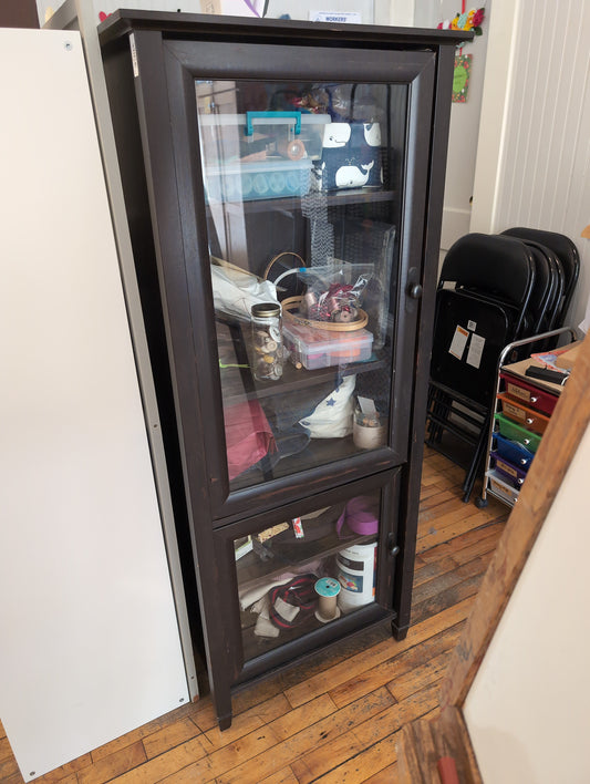 black cabinet with glass doors