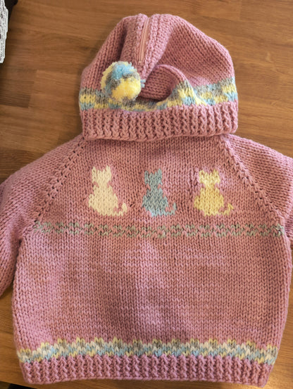 Hand knit baby sweaters