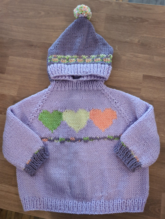 Hand knit baby sweaters