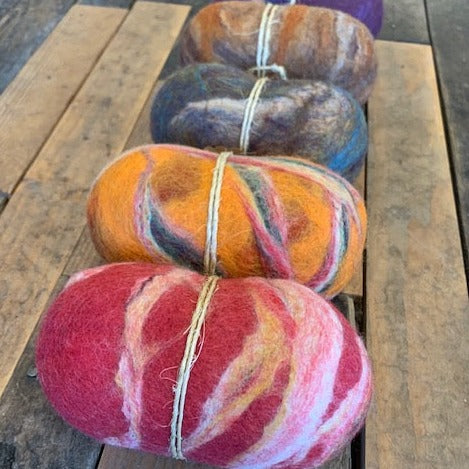 A group of felted wool muscle rollers